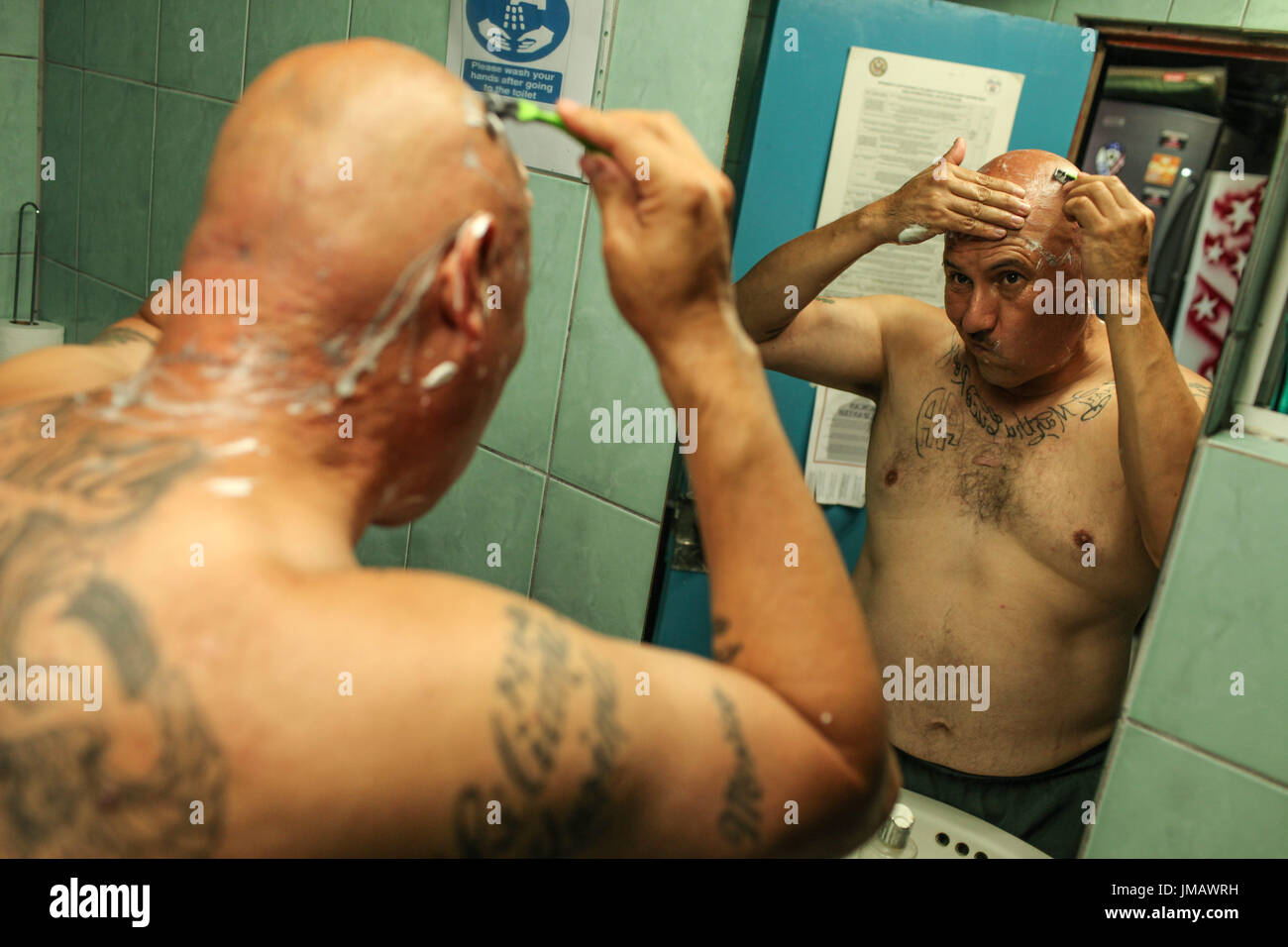 Tijuana, Baja California, Mexico. 7th July, 2017. HECTOR BARAJAS-VARELA, a deported U.S. Army veteran, shaves his head as part of his hygiene routine at the Deported Veterans Support House in Tijuana, Baja California, Mexico. Credit: Joel Angel Juarez/ZUMA Wire/Alamy Live News Stock Photo