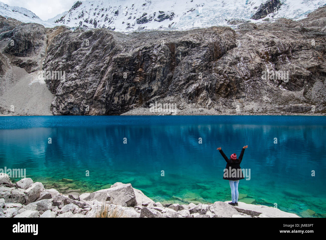 Girl at Laguna 69 with outstretched arms taking in the beautiful landscape! Stock Photo