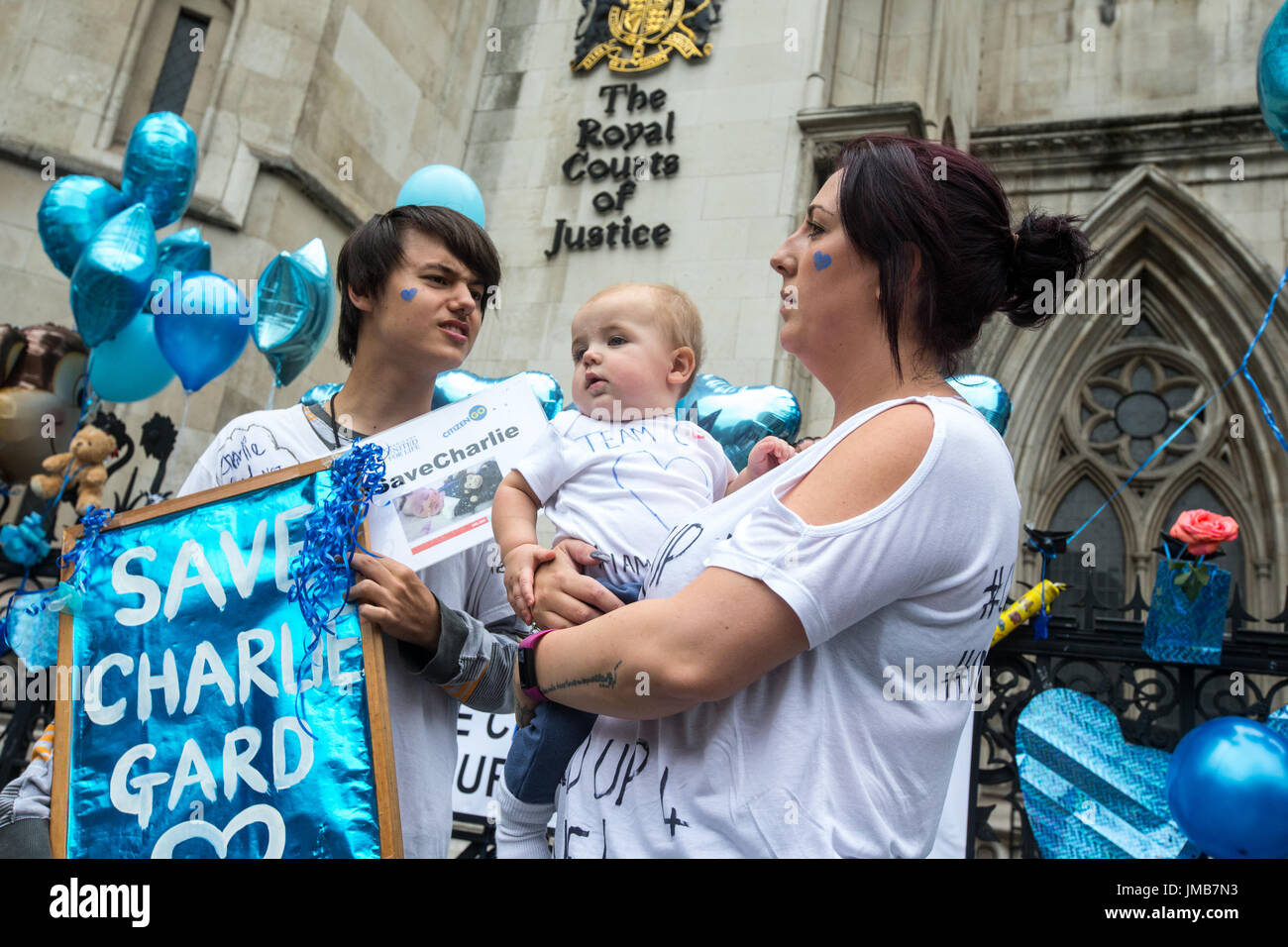 Supporters of the terminally-ill baby, Charlie Gard, demonstrate outside the High Court as Chris Gard and Connie Yates, say they are ending their case Stock Photo