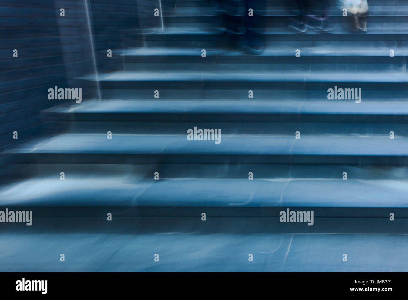 Ghostly blue steps with feet Stock Photo