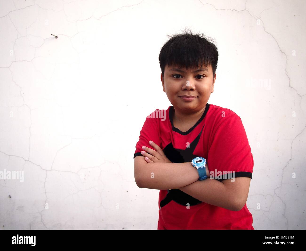 Portrait of a young Asian boy wearing a red shirt Stock Photo Alamy
