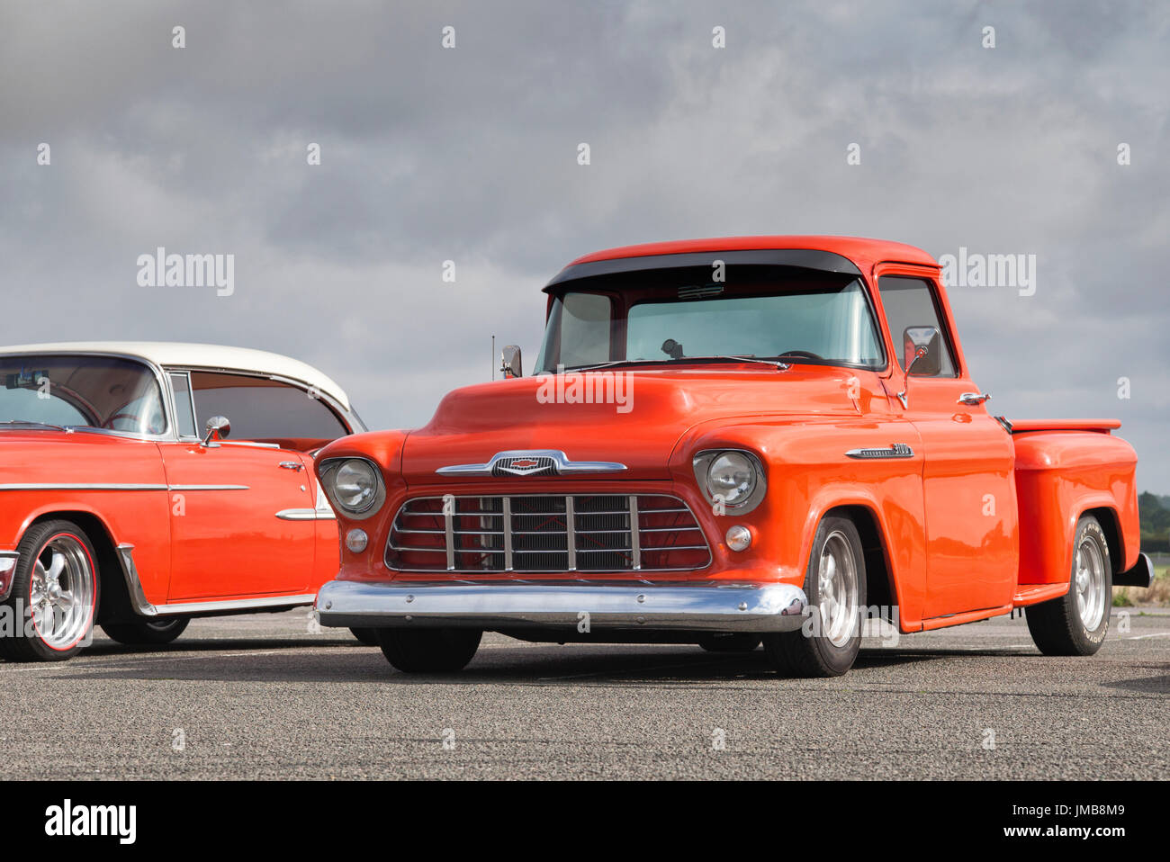 1956 Orange Custom Chevrolet pick up truck at an american car show. Essex. UK Stock Photo