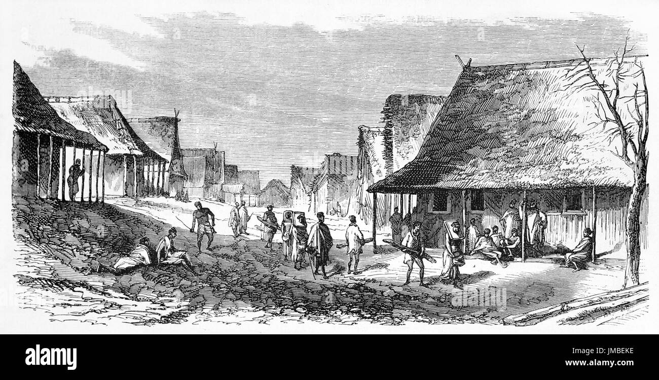 Everyday life in a small village with huts in Tamatave, Madagascar. Ancient grey tone etching style art by Bérard, Le Tour du Monde, 1861 Stock Photo