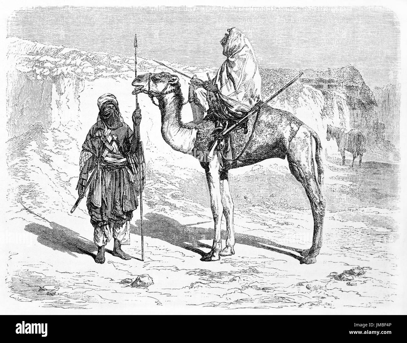 Two Tuareg men outdoor in the warm desert in their typical costumes. One on camel back. Sahara, Algeria. Etching style art by Hadamard 1861 Stock Photo