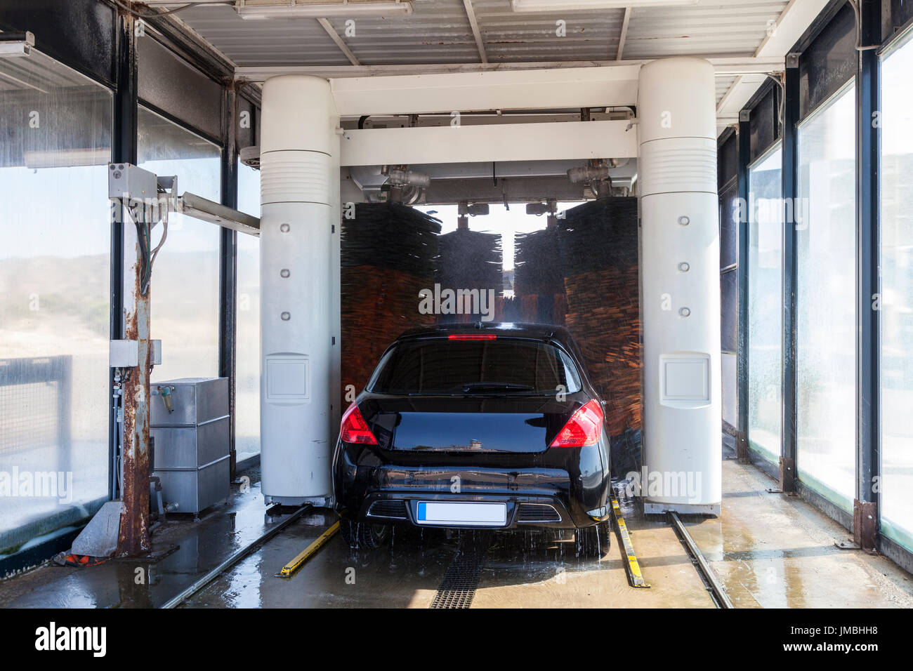 Car being washed in an automatic vehicle wash service station Stock Photo Alamy