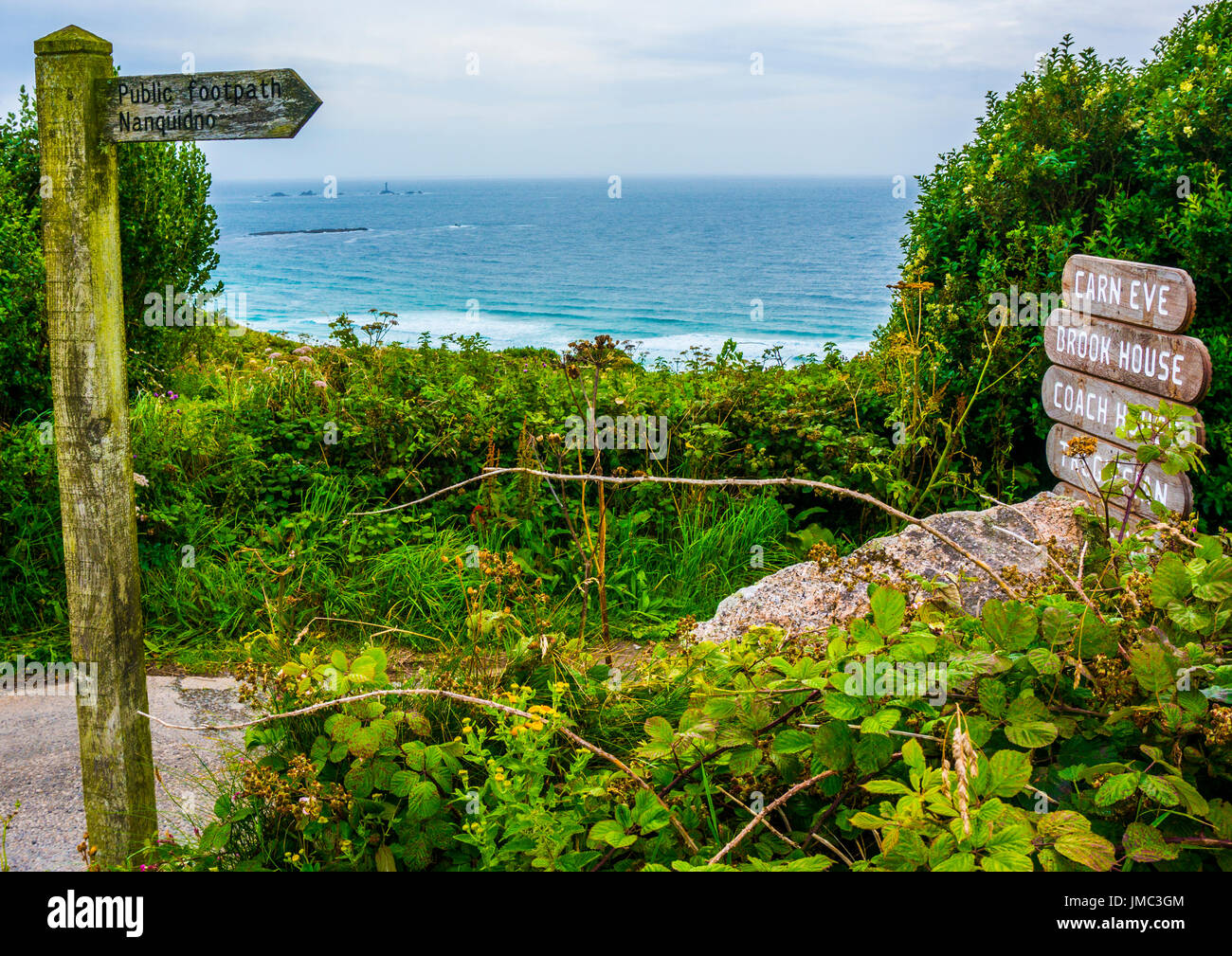 Public footpath to Nanquidno sign overlooking the sea, Cornwall, England, UK Stock Photo