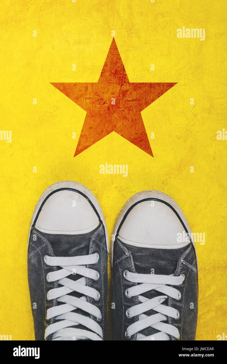 Young activist standing  on the road with star shape imprint - youth activism and political action concept Stock Photo