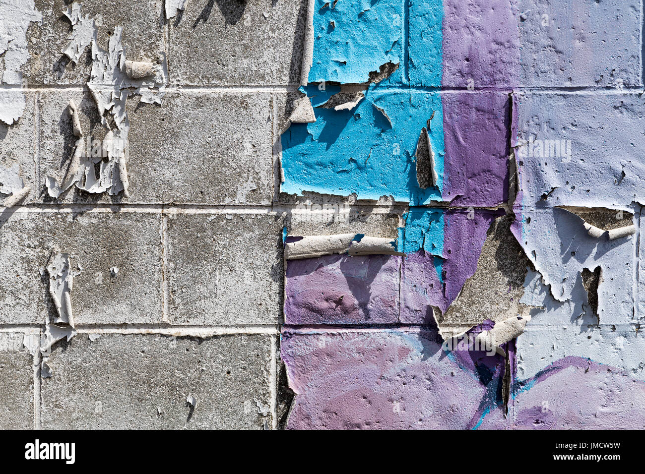 Peeling paint on a brick wall Stock Photo