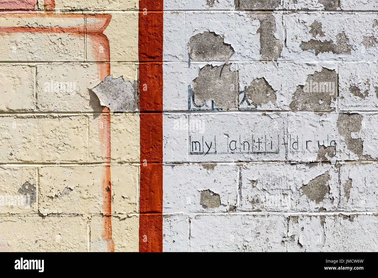 Peeling paint on a brick wall Stock Photo