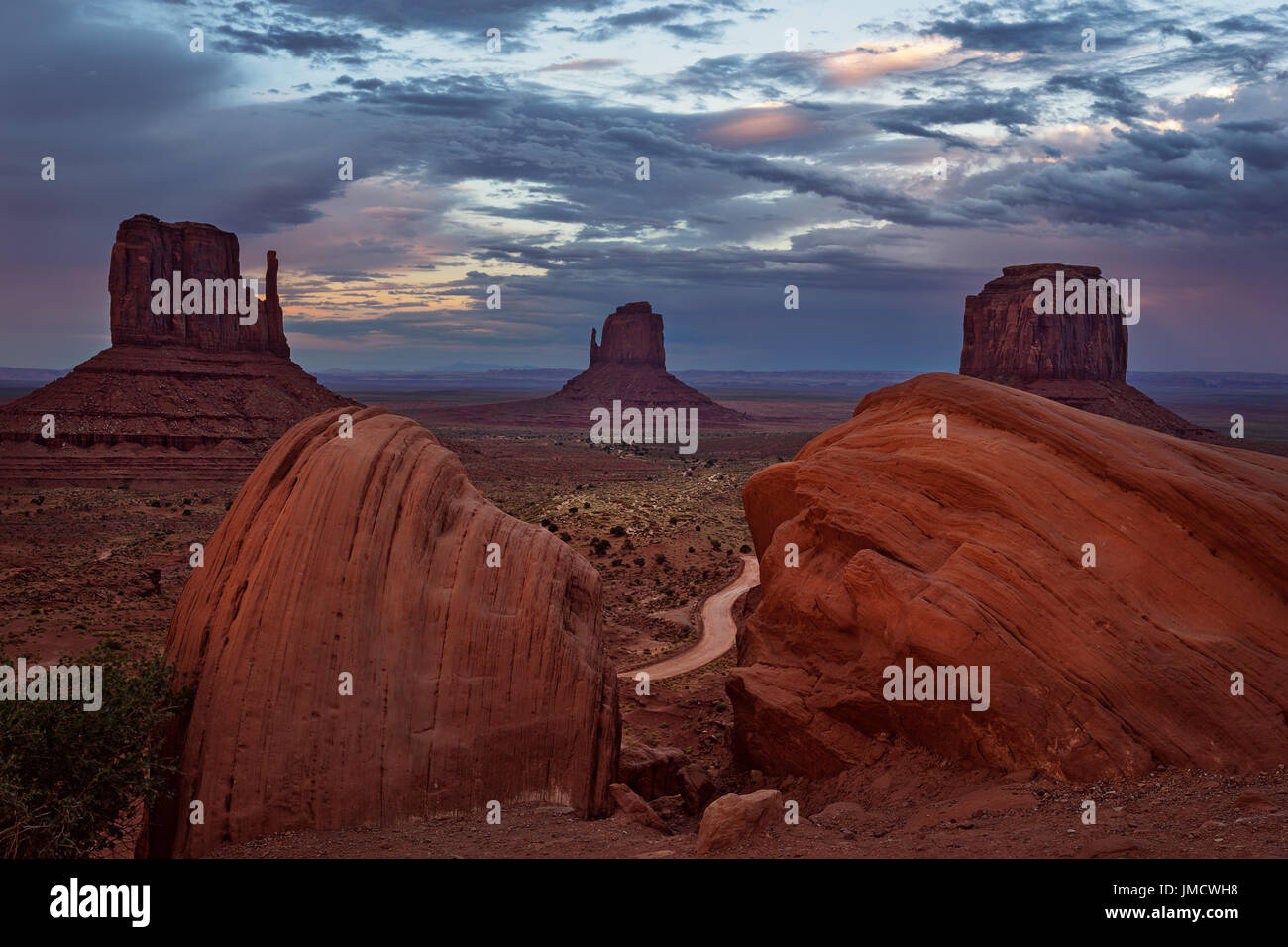 The Mittens and Merrick Butte at Sunset, Monument Valley Navajo Tribal Park, Arizona Stock Photo
