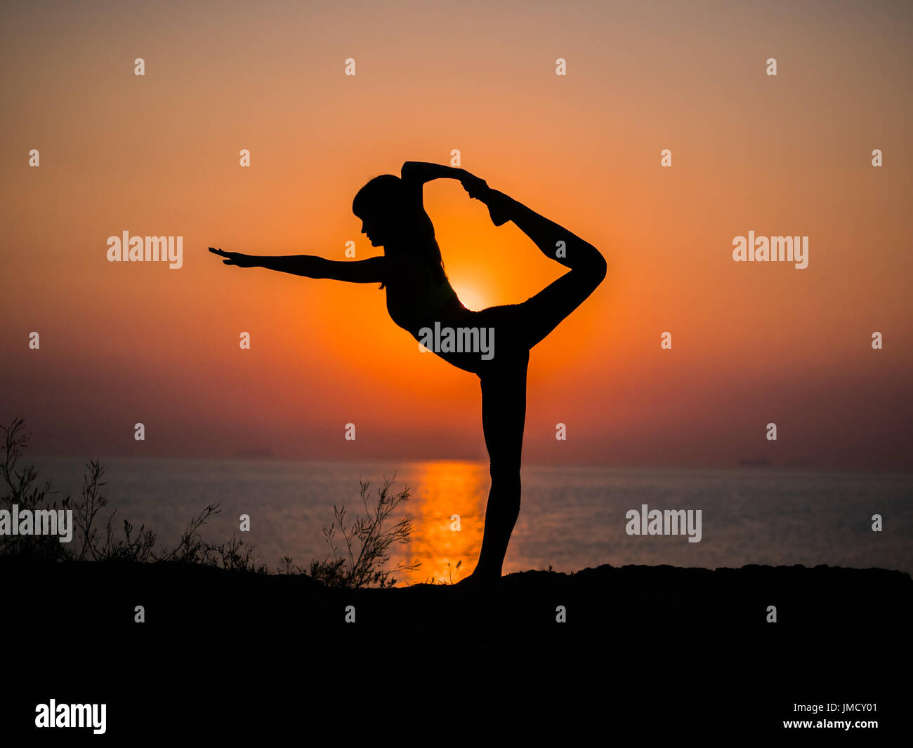 Morning exercise. Twine. Yoga mat woman stretching hip, hamstring