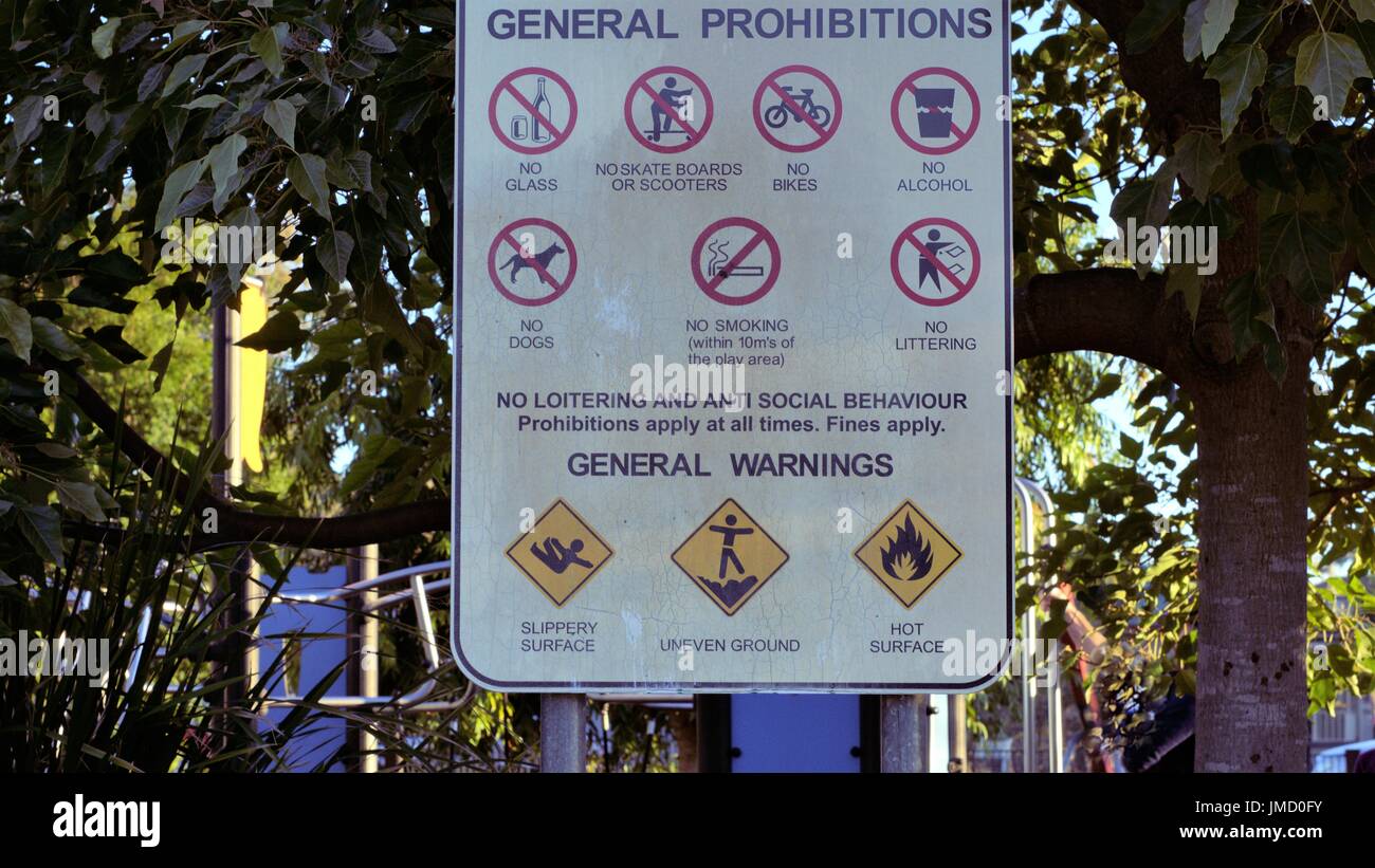 Sign board outside public park. General warnings to follow. Rules to follow in public park sign Stock Photo