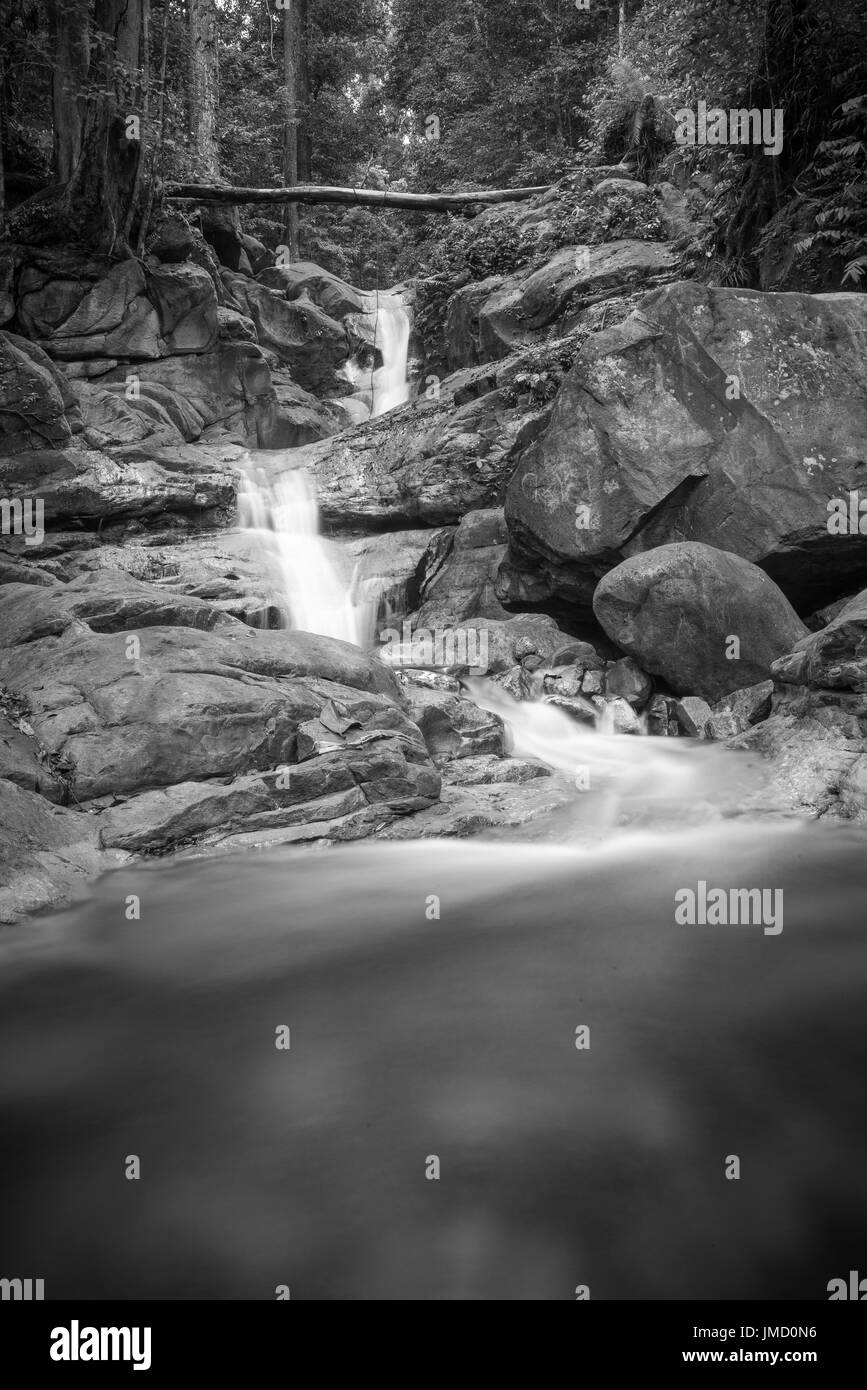 Black and white photograph of rainforest waterfall and riverside scenery taken in the national parks of Sarawak, Malaysia Stock Photo