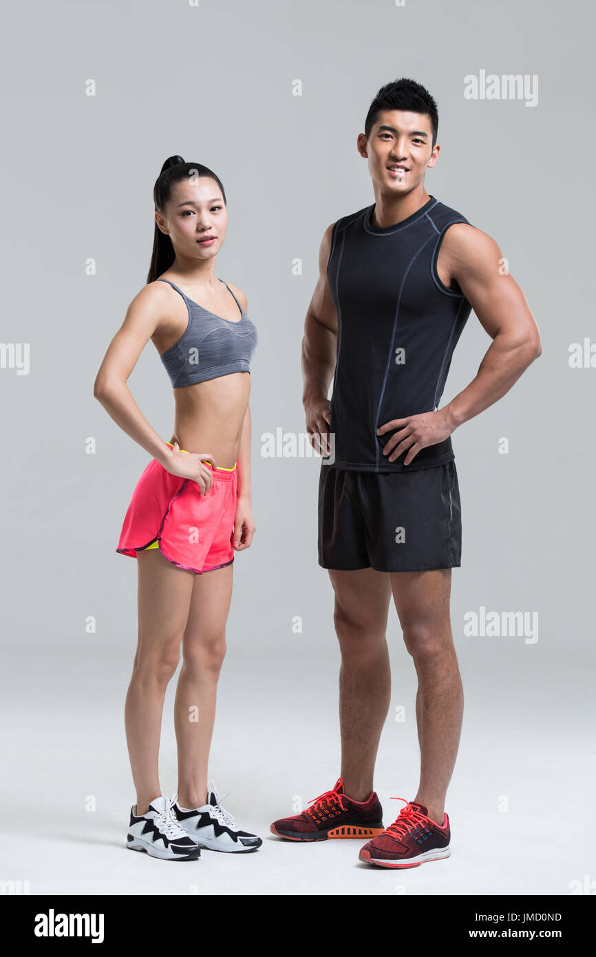Young Chinese couple wearing gym suit Stock Photo