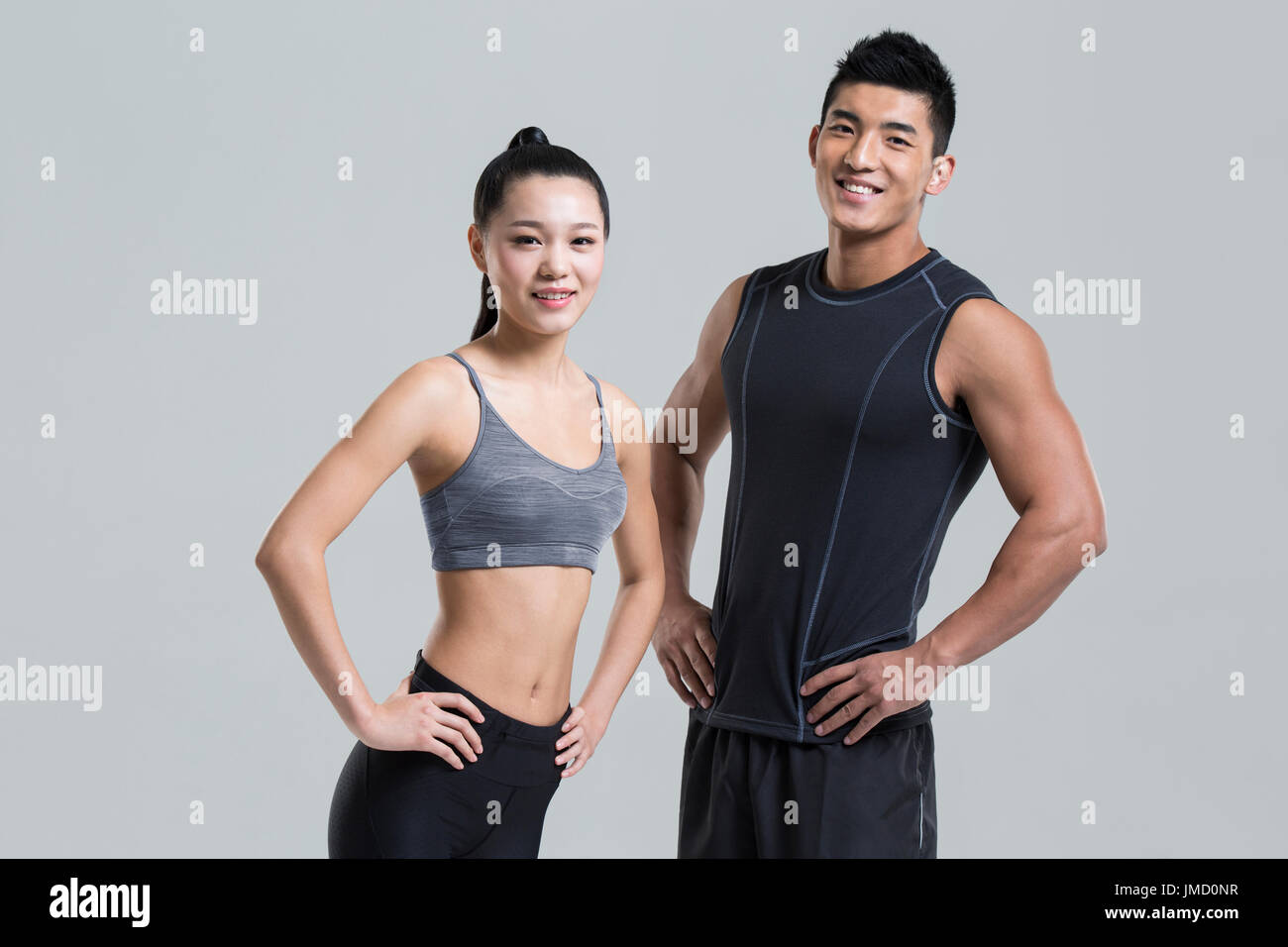 Young Chinese couple wearing gym suit Stock Photo