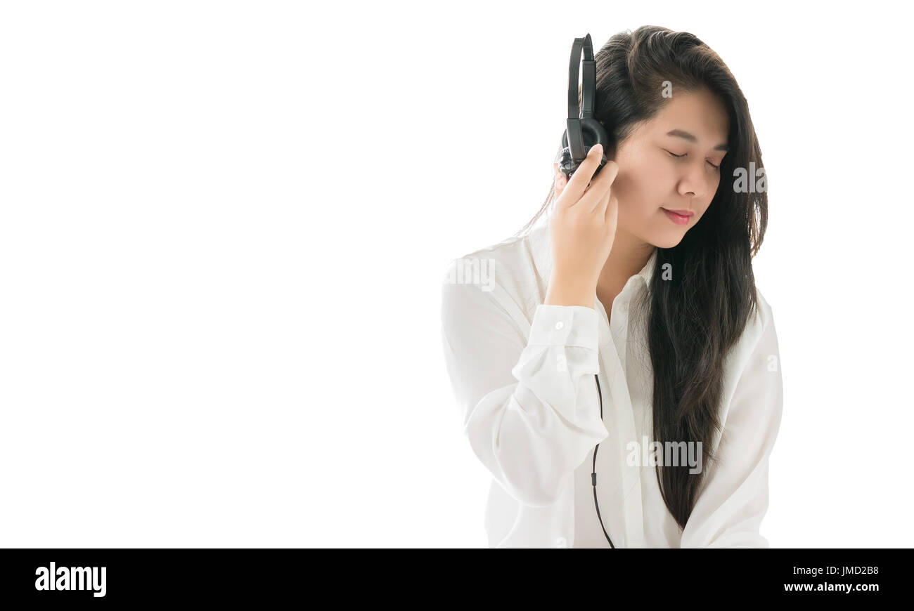 Asian women have fun and enjoy. By listening to music. After waking in the morning weekends in relex and entertainment concept Stock Photo