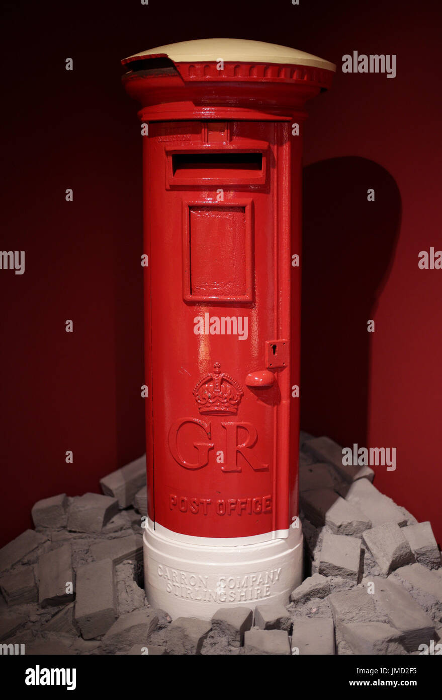 Embargoed to 0001 Friday July 28 A George V Pillar Box, 1927-1935, which was damaged during the Second World War, on display during a preview of the Postal Museum in London. Stock Photo