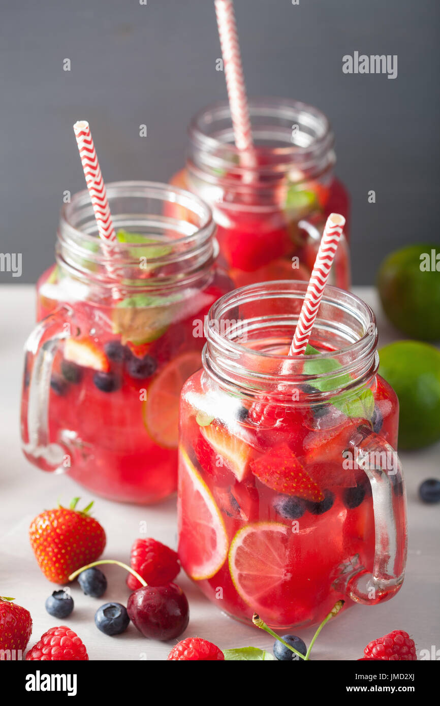 summer berry lemonade with lime and mint in mason jar Stock Photo Alamy