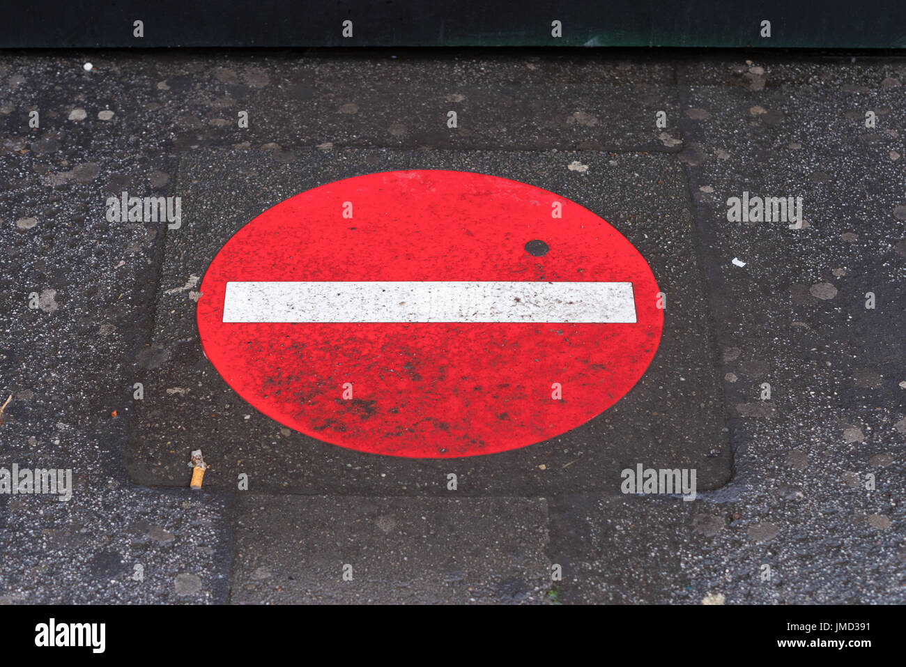 red no entry sign painted on a sidewalk Stock Photo