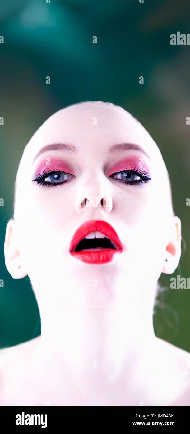 Female model futuristic alien android, high key bald head.concept Stock Photo