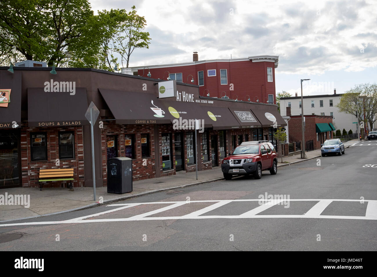 small strip mall corner shops on savin hill avenue Boston USA Stock Photo
