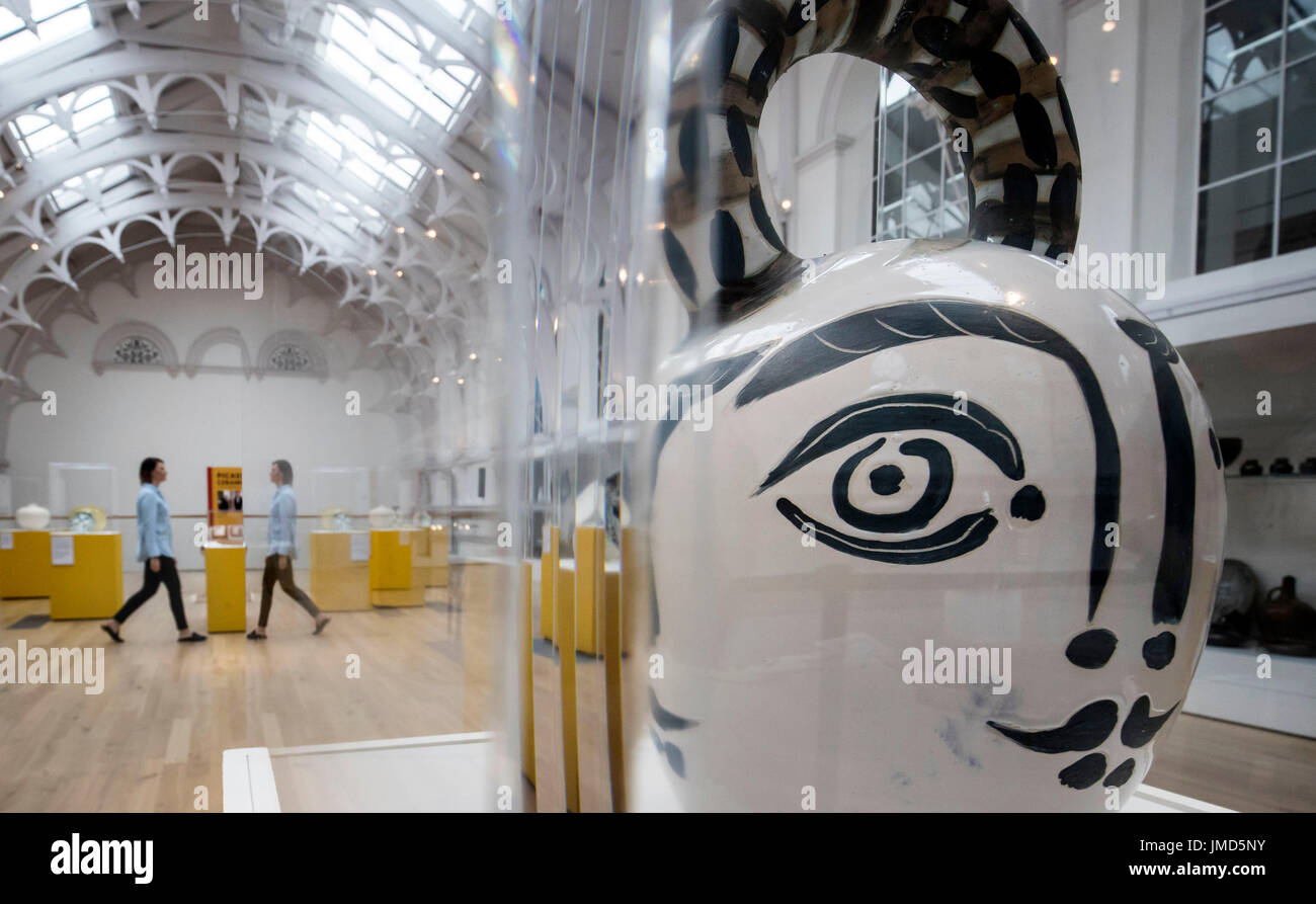 Gallery employee Lauren Masterman, is pictured reflected in a display cabinet during a preview for the new exhibition, Picasso: Ceramics from the Attenborough Collection, showcasing highlights from Lord Richard Attenborough's collection; the most significant private collection of Picasso ceramics in the UK, at York Art Gallery. Stock Photo