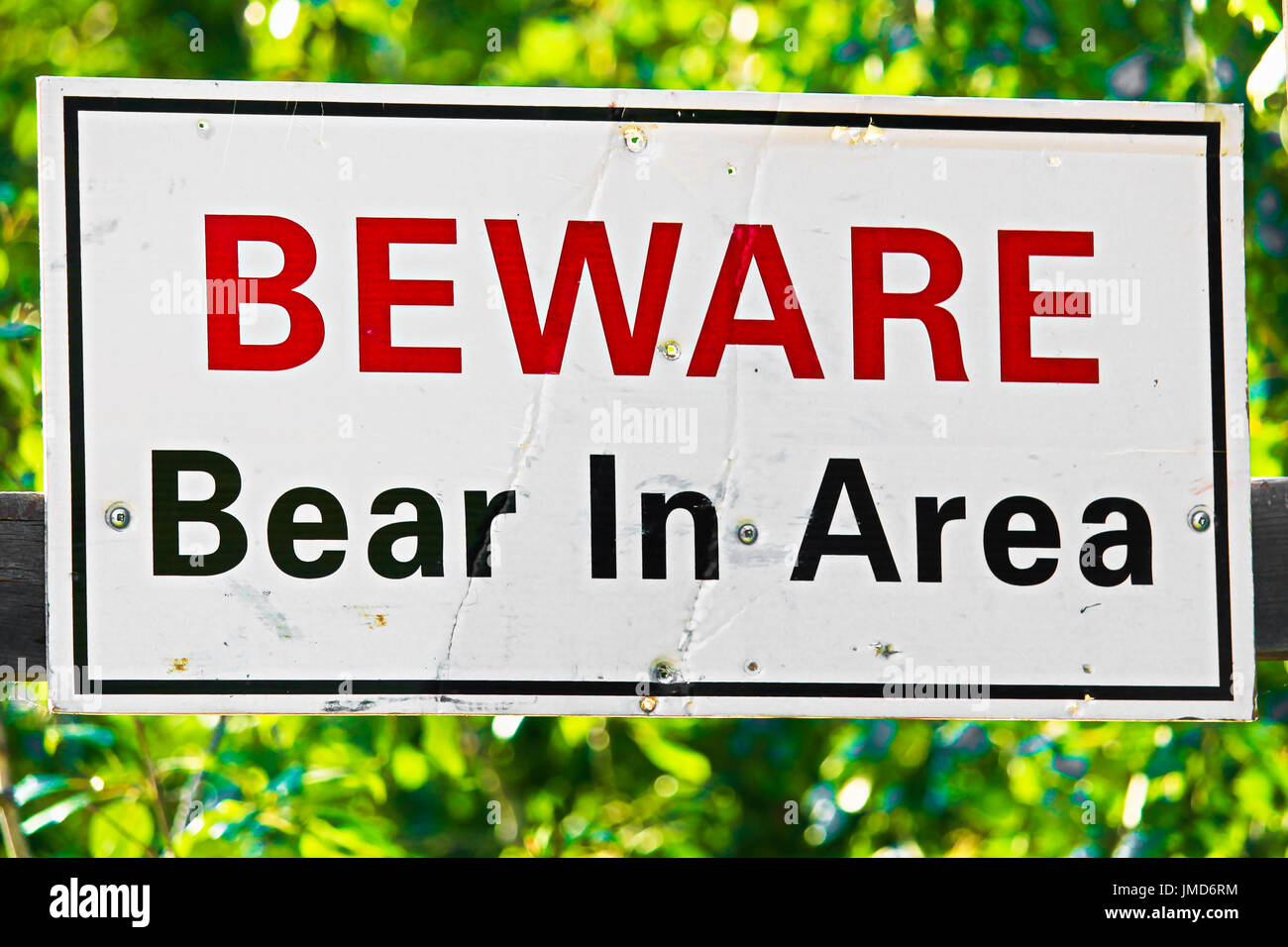 a white beware bear in area sign. Stock Photo