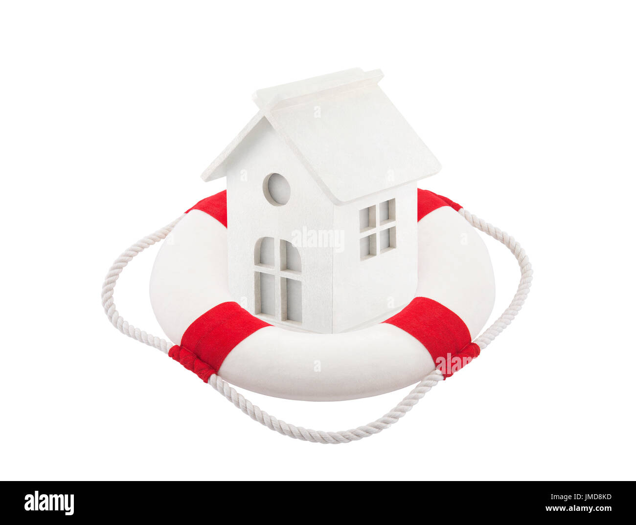 Small white toy house in lifebuoy over white background Stock Photo