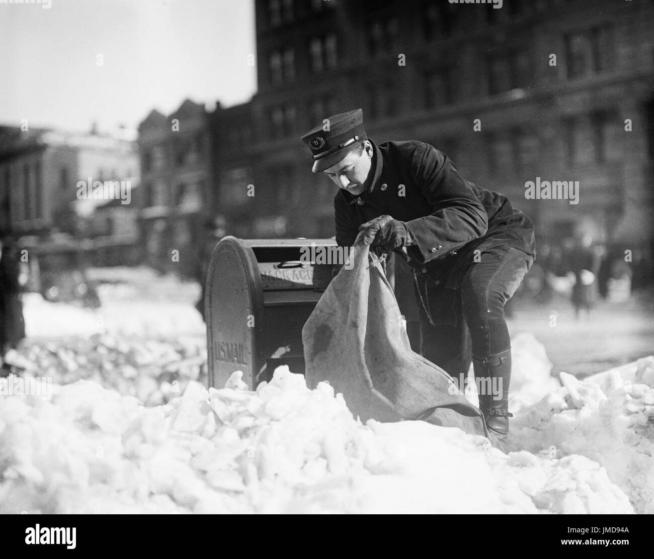 Mailman Collecting Mail from Mailbox after Blizzard, Washington DC, USA, Harris and Ewing, January 1922 Stock Photo