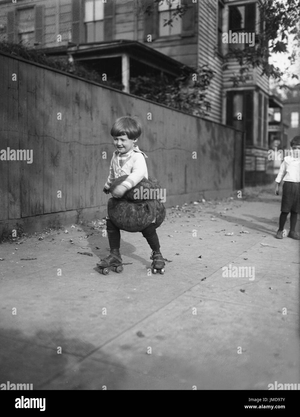 Young Boy Rollerskating with Pillows, Harris & Ewing, 1924 Stock Photo