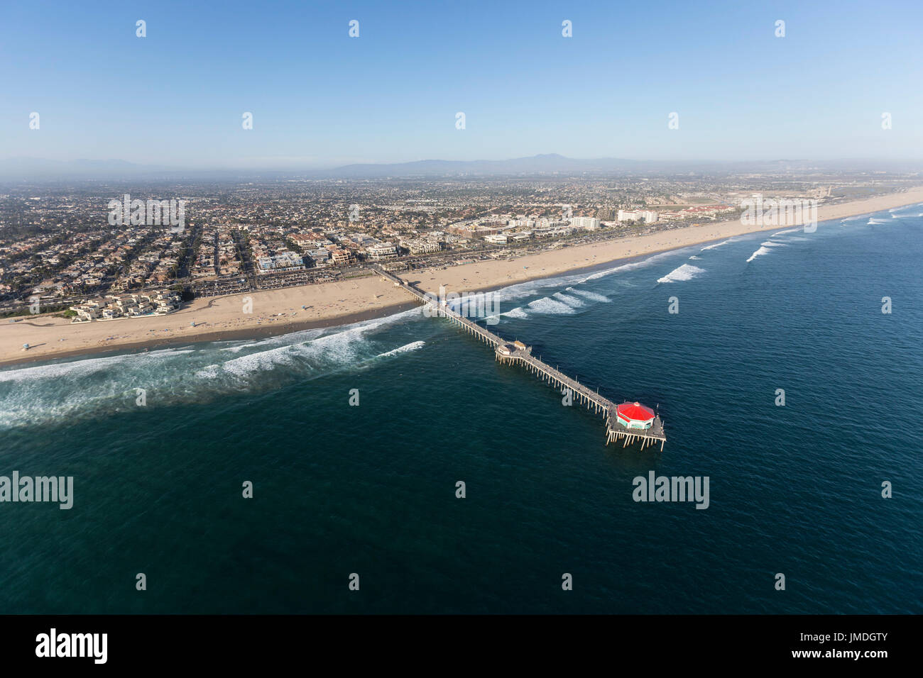 Aerial of Huntington Beach Pier on the Orange County Coast in Southern California. Stock Photo