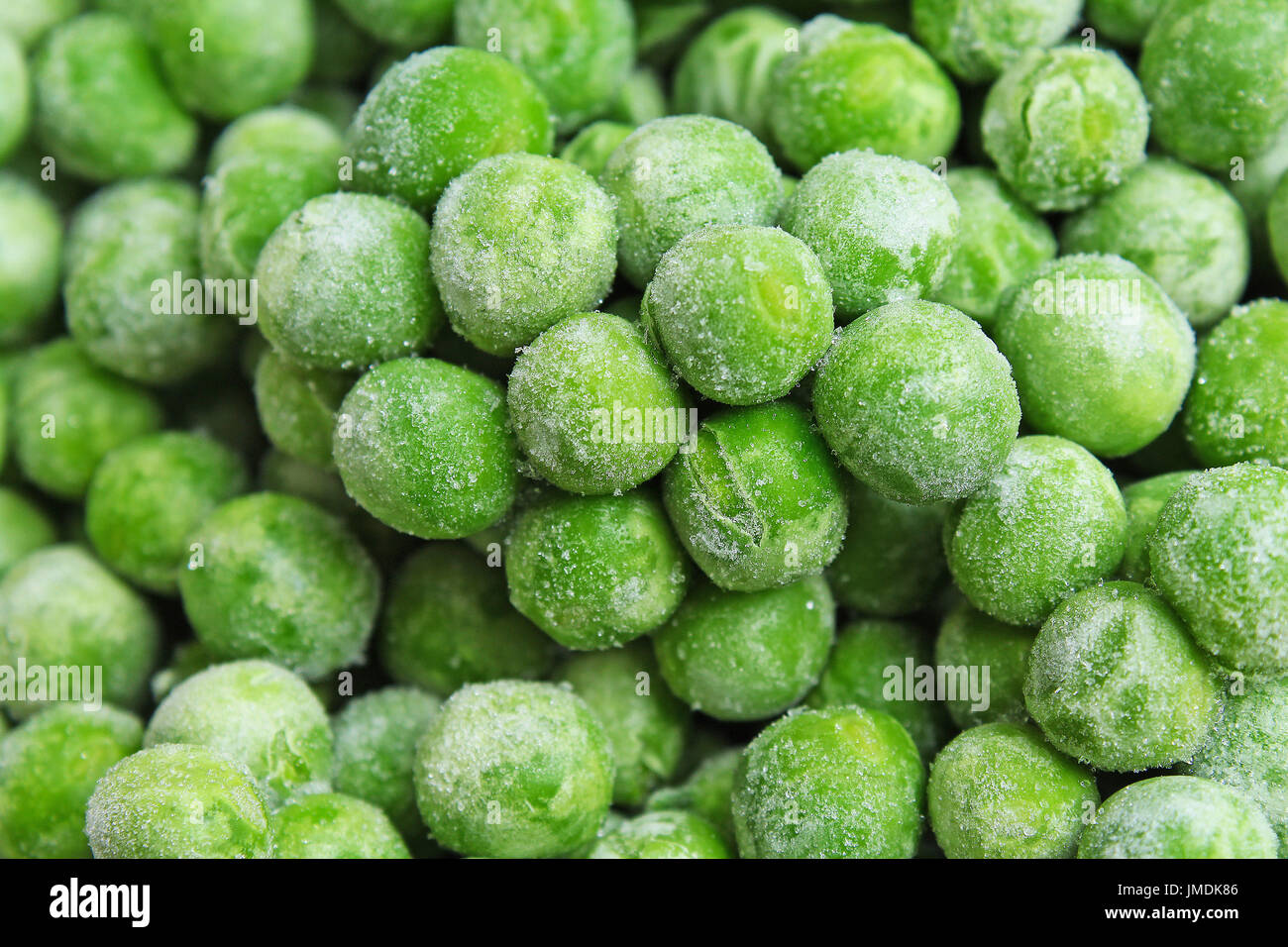 Frozen pea peases texture background. Green pease background pattern. Stock Photo