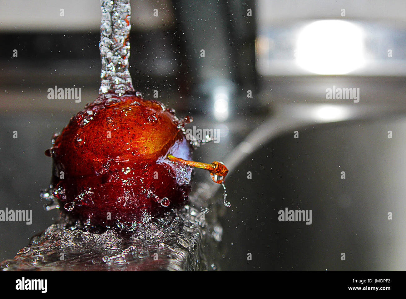 It is a picture of plum under water Stock Photo