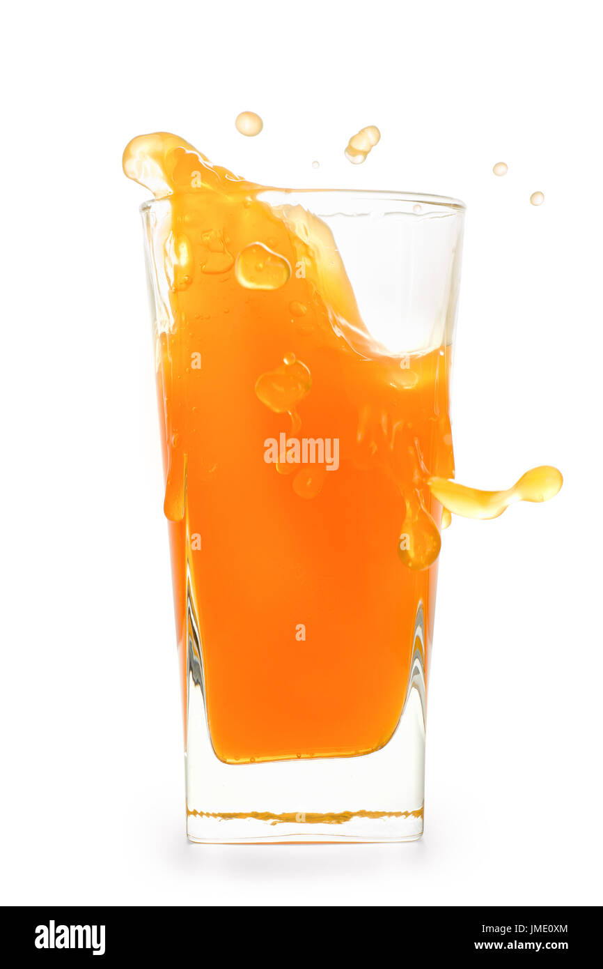 Splash in glass of orange juice with flying drops. Isolated on white