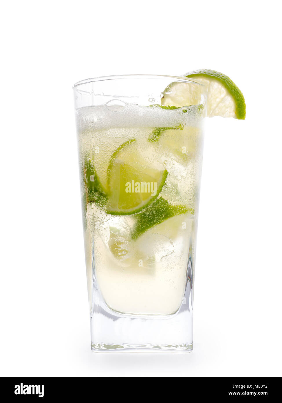 Mojito cocktail in glass. Transparent drink, lime, ice, foam and bubbles. Isolated on white, clipping path included Stock Photo