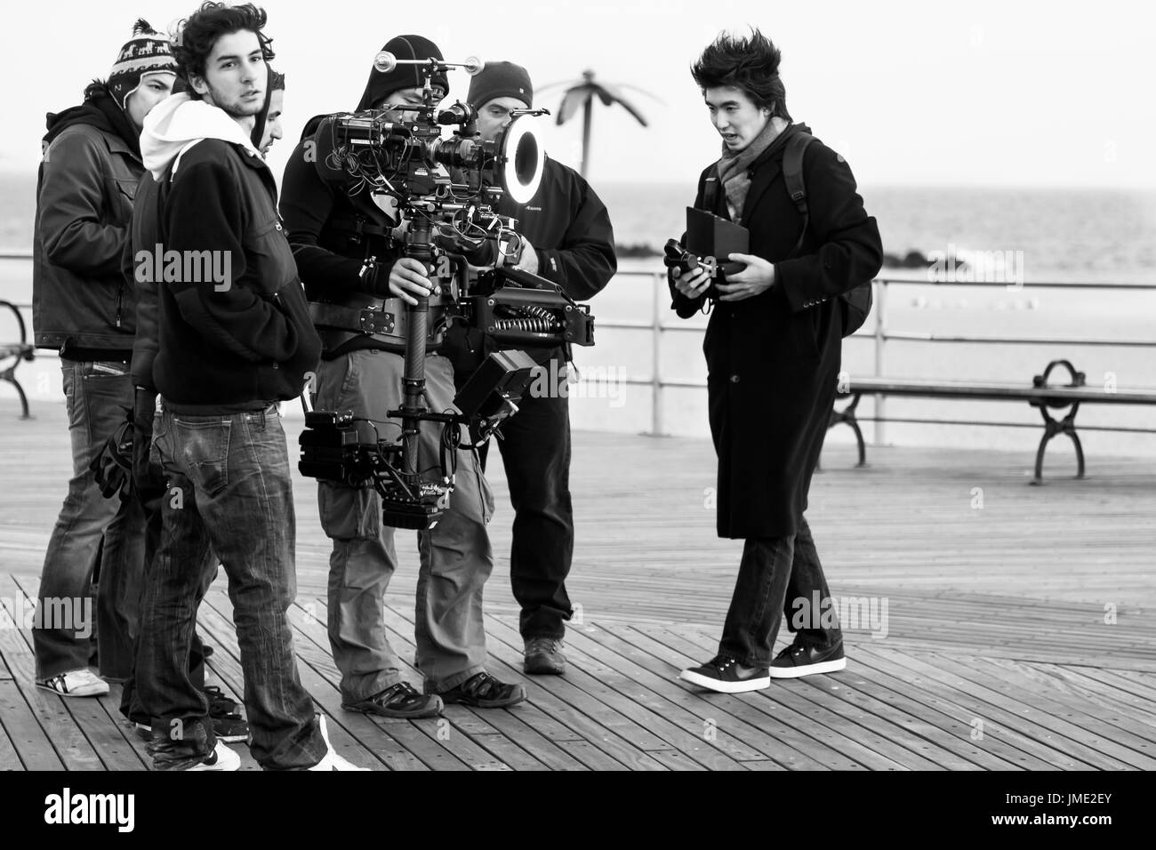 NEW YORK CITY-NOV 2010: A film crew working on location at the Coney Island boardwalk. Black and white image. Stock Photo