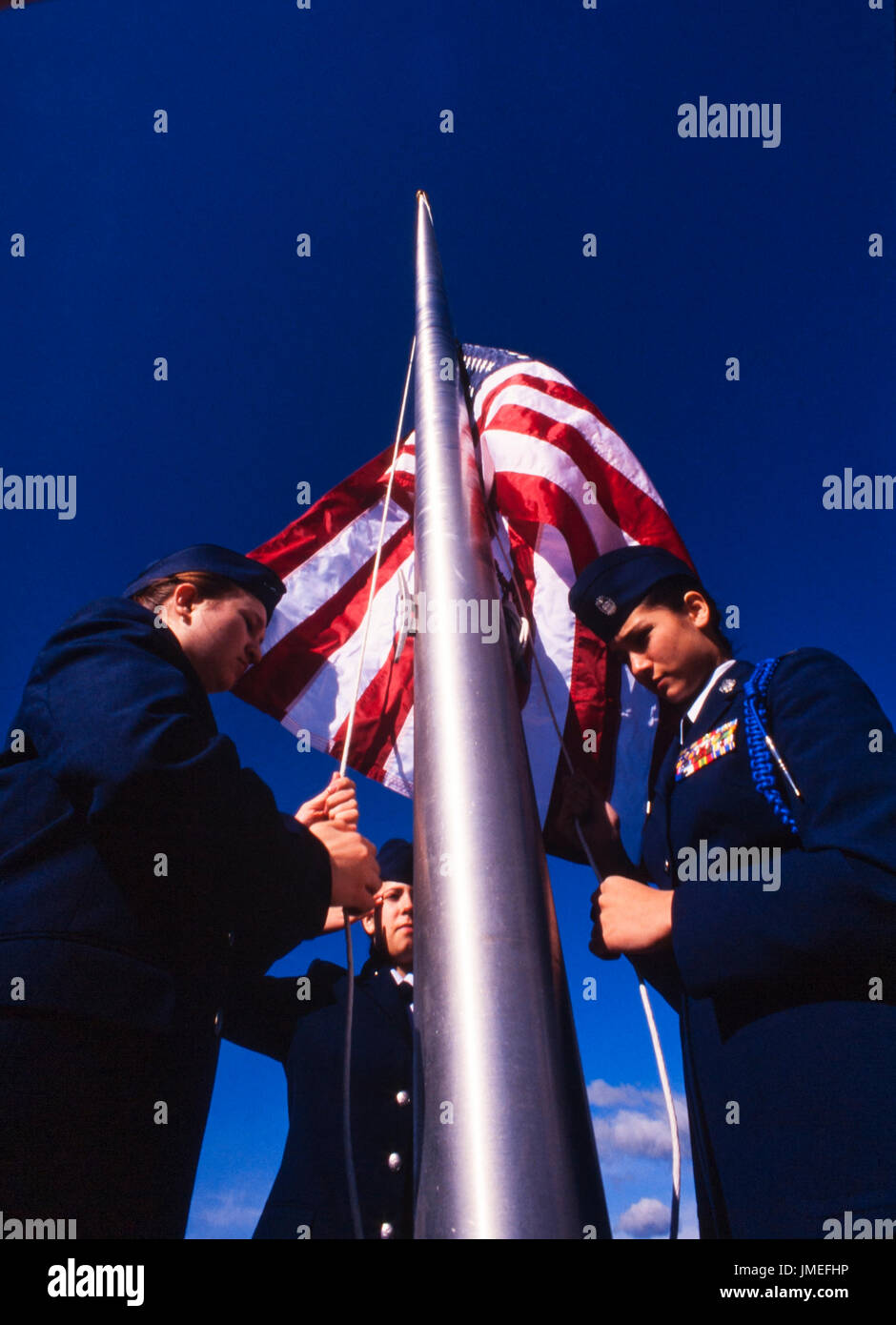 US flag raising ceremony performed by US Air Force ROTC - reserve officer training corps - high school cadets in uniform outside their high school Stock Photo