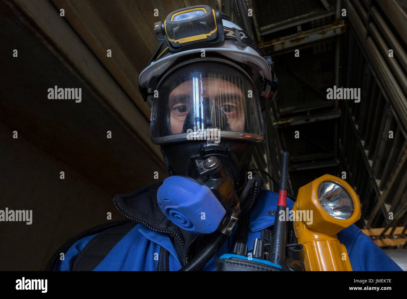 Plain unedited image of a North sea oil and gas worker, wearing full BA breathing apparatus. credit: LEE RAMSDEN / ALAMY Stock Photo