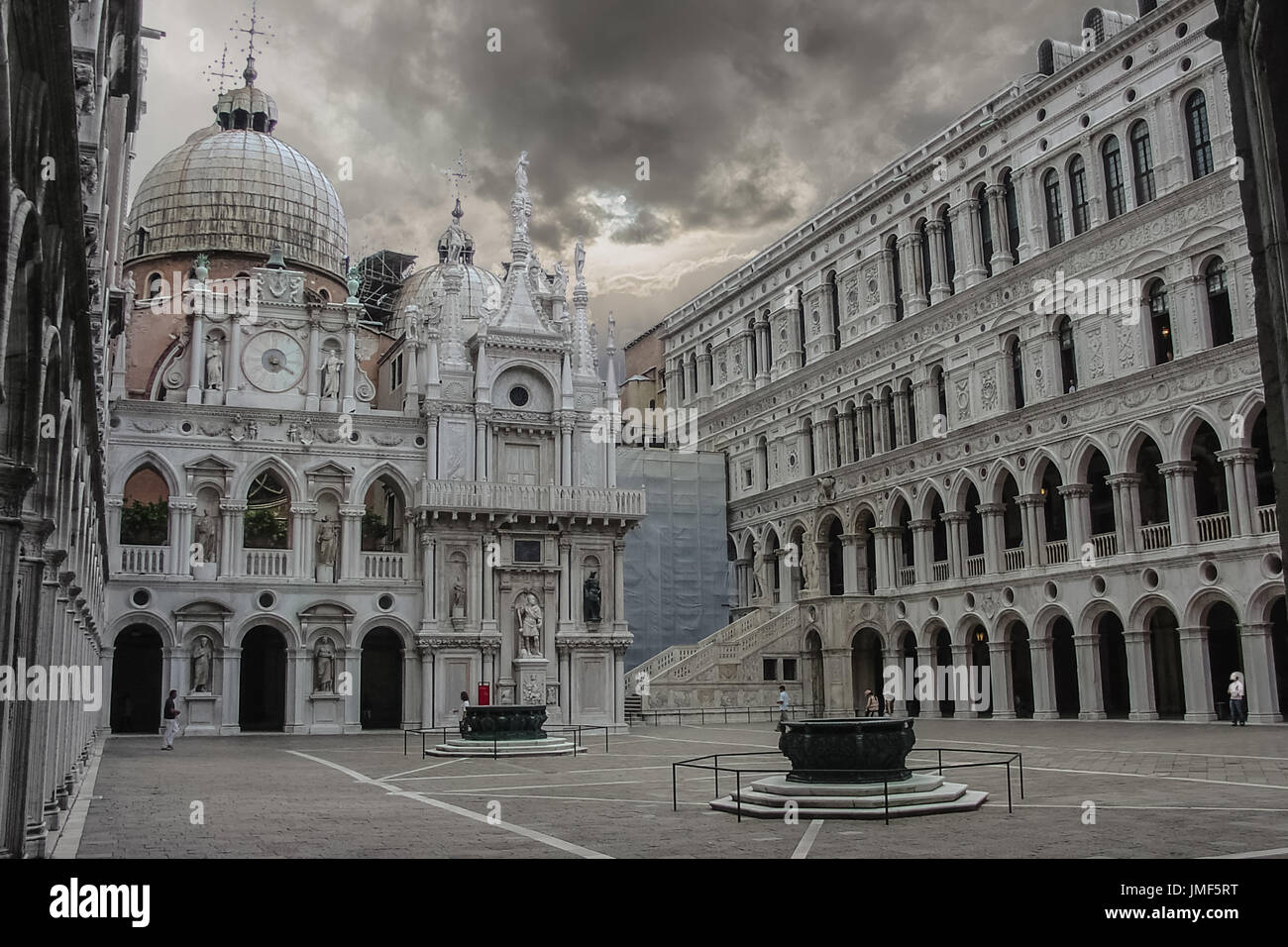 Palazzo Ducale or the Doge's Palace in Venice Italy on a dark and stormy late afternoon with gray, foreboding skies and a sinister feel to the photo Stock Photo