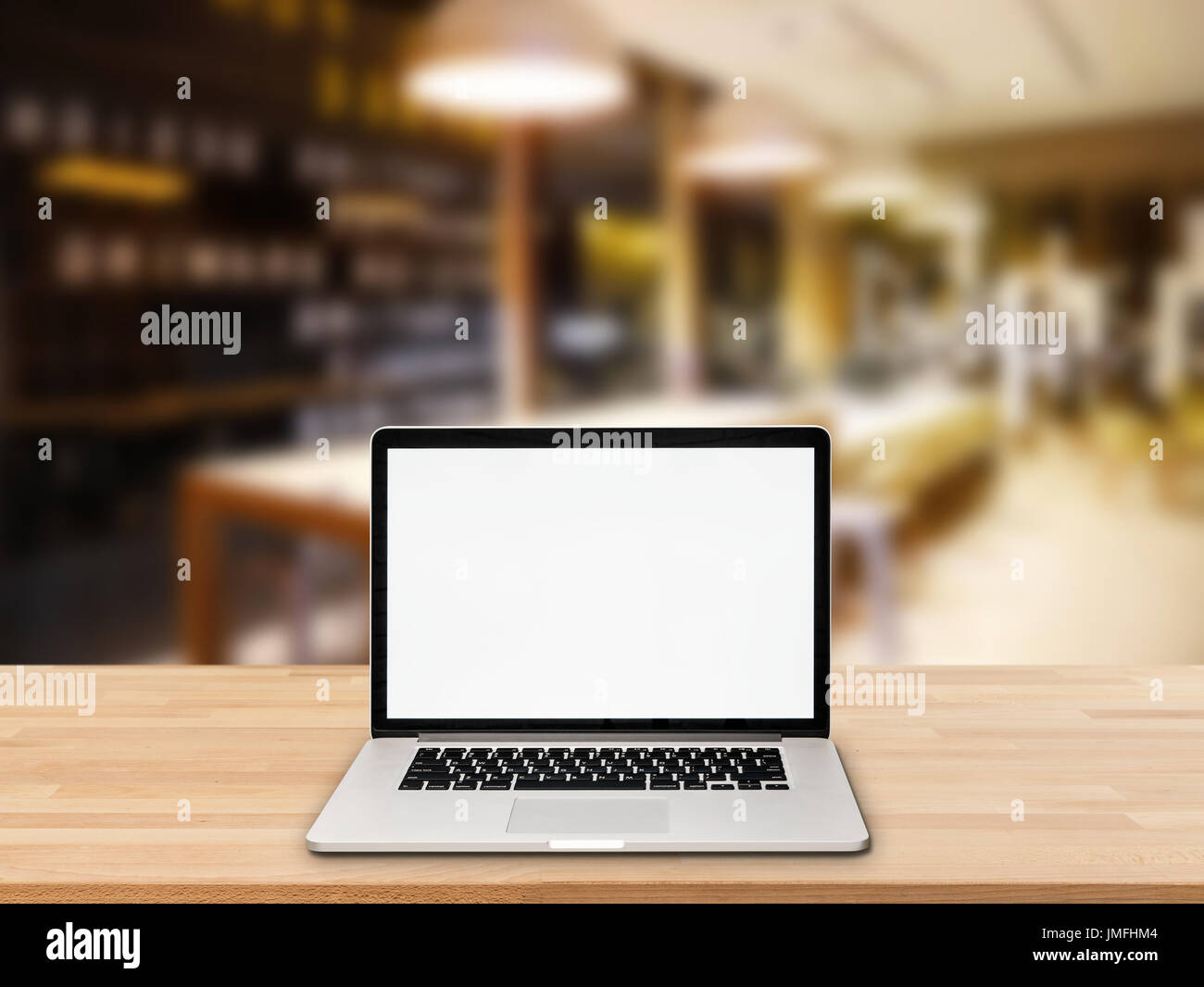 computer notebook with blank screen on wooden table Stock Photo