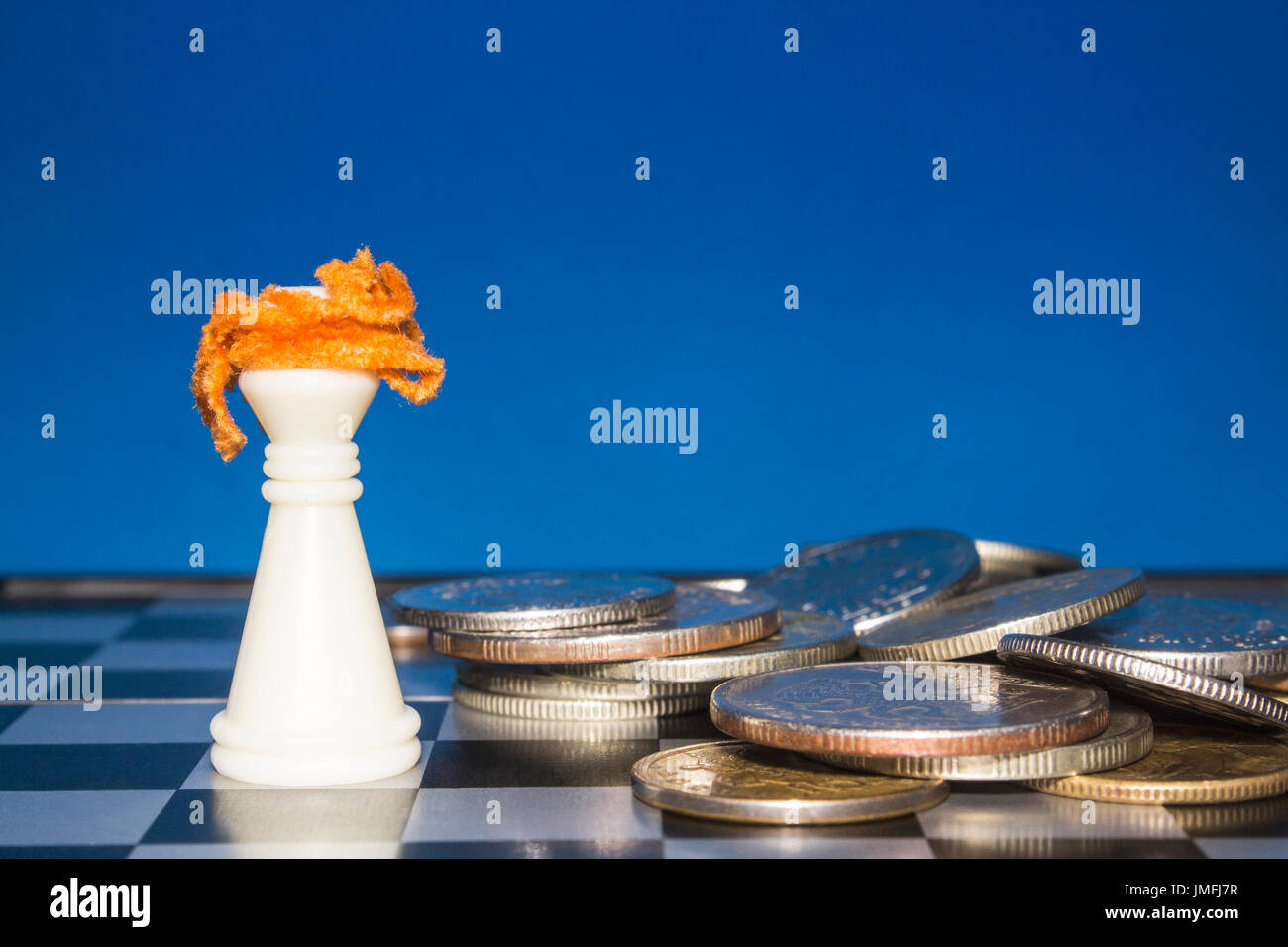 Chess board with coins hi-res stock photography and images - Alamy