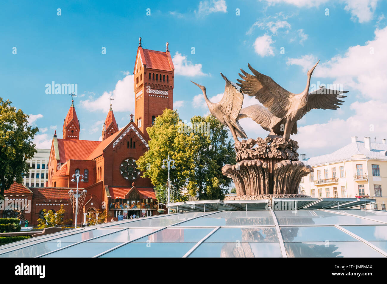 Minsk, Belarus. Close Bronze Sculpture Of Three Storks Cranes On Top Of Glass Dome Of Stolitsa, Underground Shopping Center At Independence Square And Stock Photo