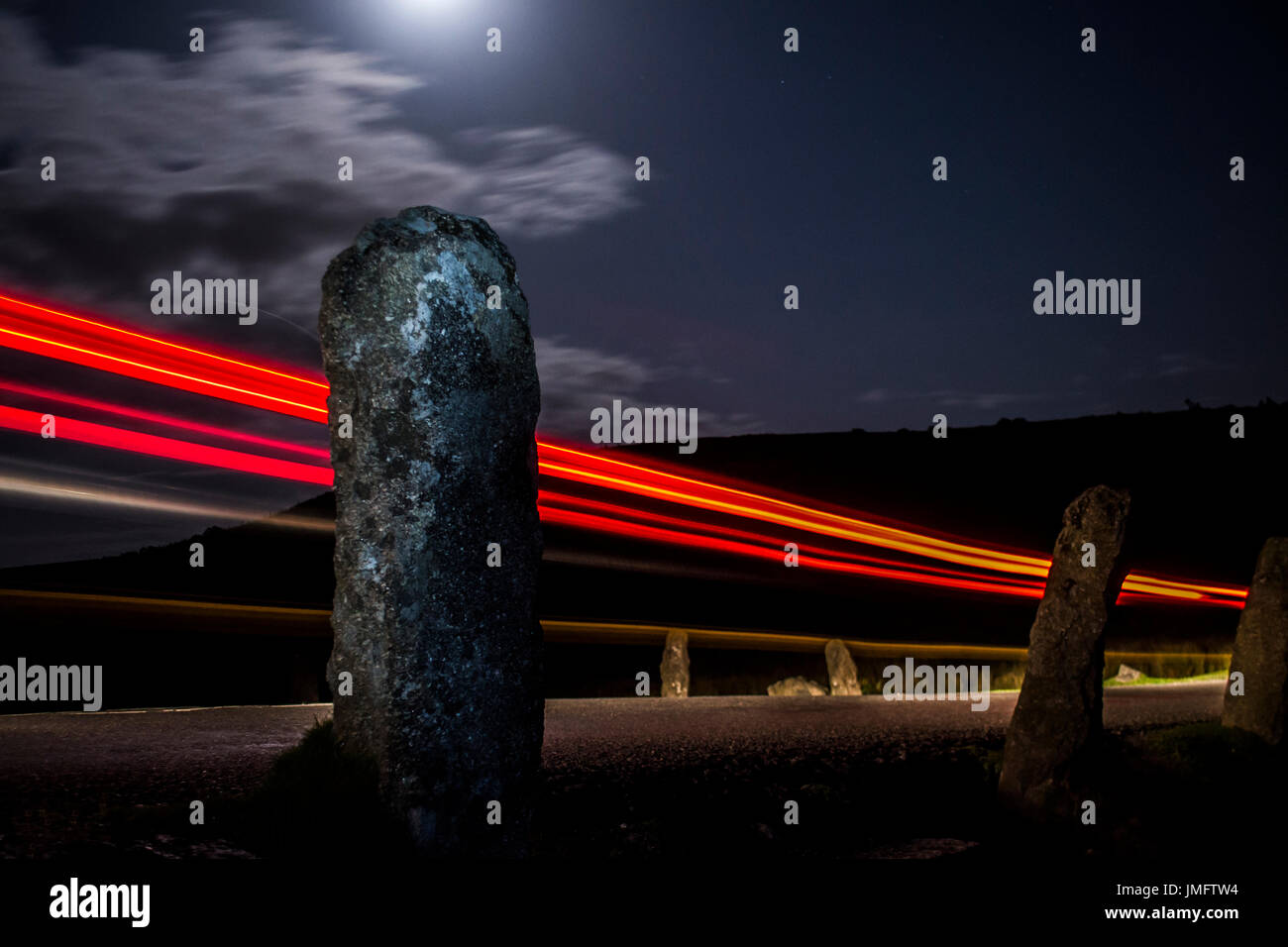 Long Exposure Car trail with Moon and sky Stock Photo