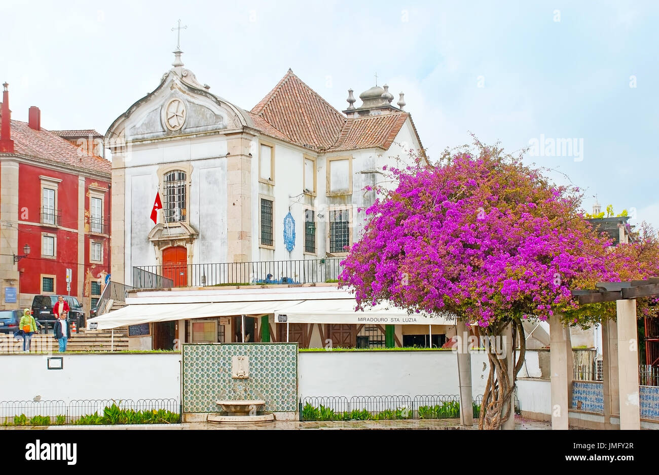 LISBON, PORTUGAL - MAY 2, 2012: The view on the Santa Luzia Church, the notable landmark of Alfama district, from garden of Julio de Castilho with blo Stock Photo