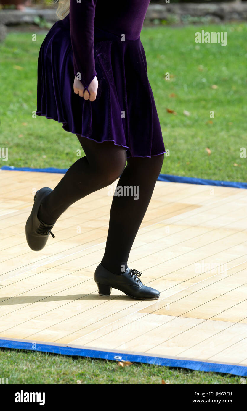 A girl performing traditional Irish dancing in public, UK Stock Photo