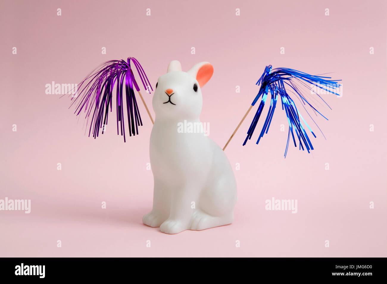 A Cute White Plastic Bunny On A Pink Background Ice Cream Palm