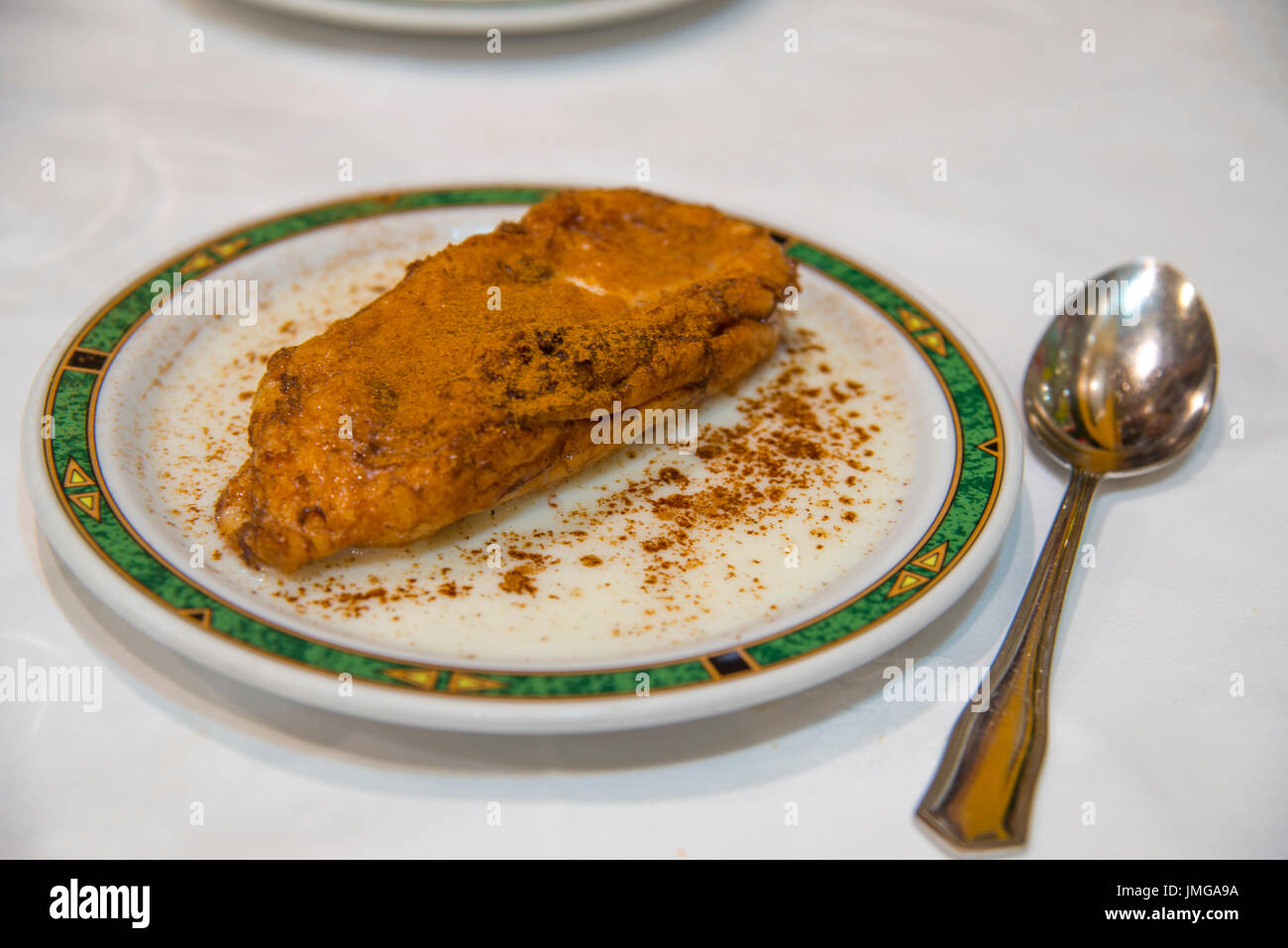 Spanish Easter dessert: torrija with milk and cinnamon Stock Photo - Alamy