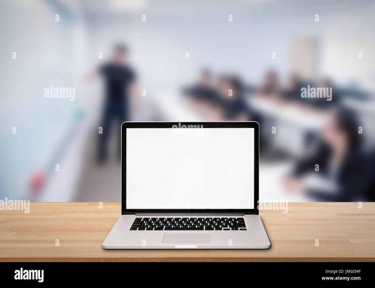 computer notebook with blank screen on wooden table Stock Photo