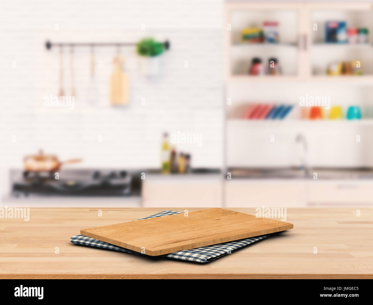 chopping board on wooden counter top with kitchen cabinet background ...