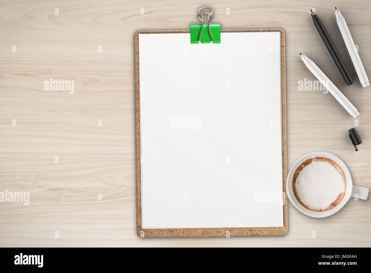 blank clipboard on office desk top view Stock Photo